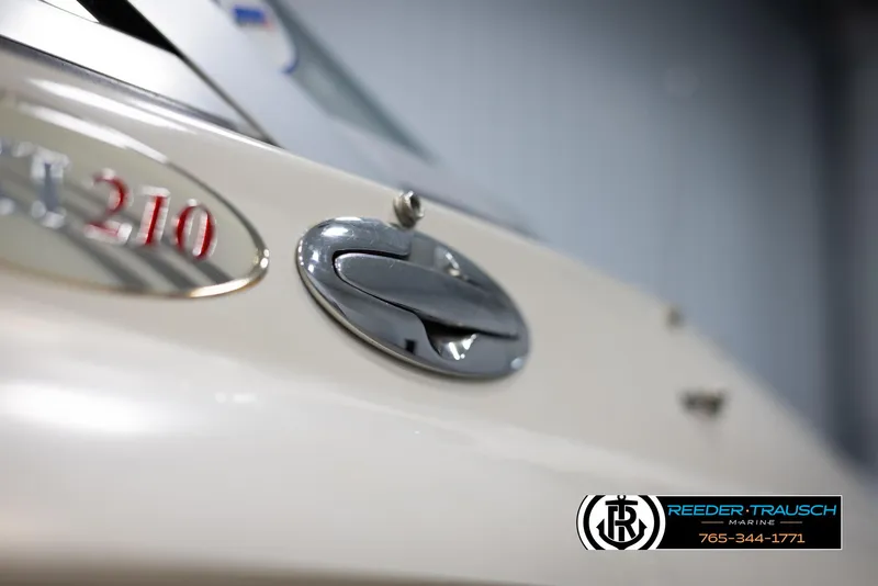 Slide: The Image of Close-up of a 2002 Larson LXI 210 boat emblem and handle. - 44