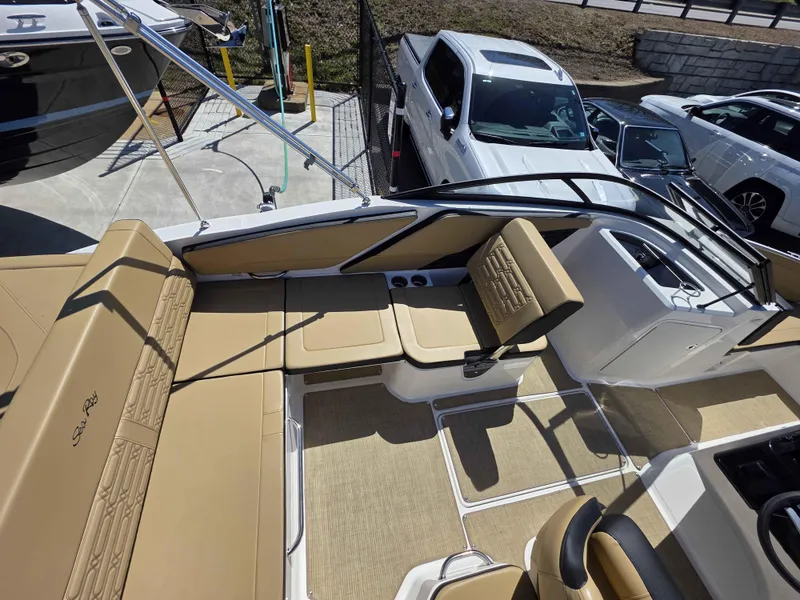 Slide: The Image of 2025 Sea Ray 210SPX boat interior with tan seating and modern design. - 7