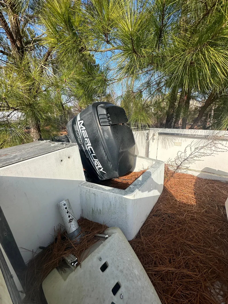 Slide: The Image of 1984 Aquasport 222 XF boat with Mercury outboard motor in a wooded area. - 4