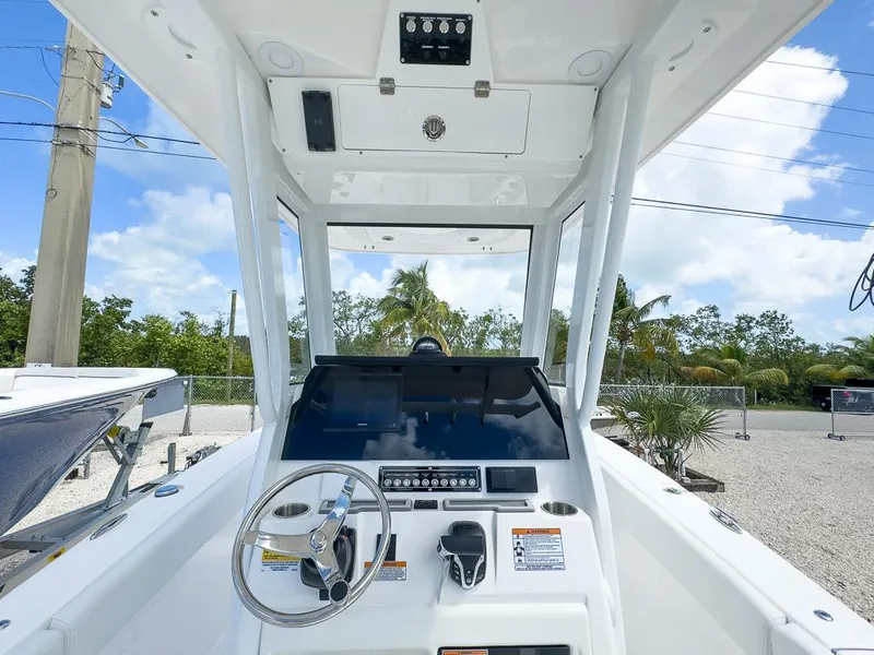 Slide: The Image of 2025 Sea Fox 248 Commander boat console with steering wheel and navigation controls. - 11