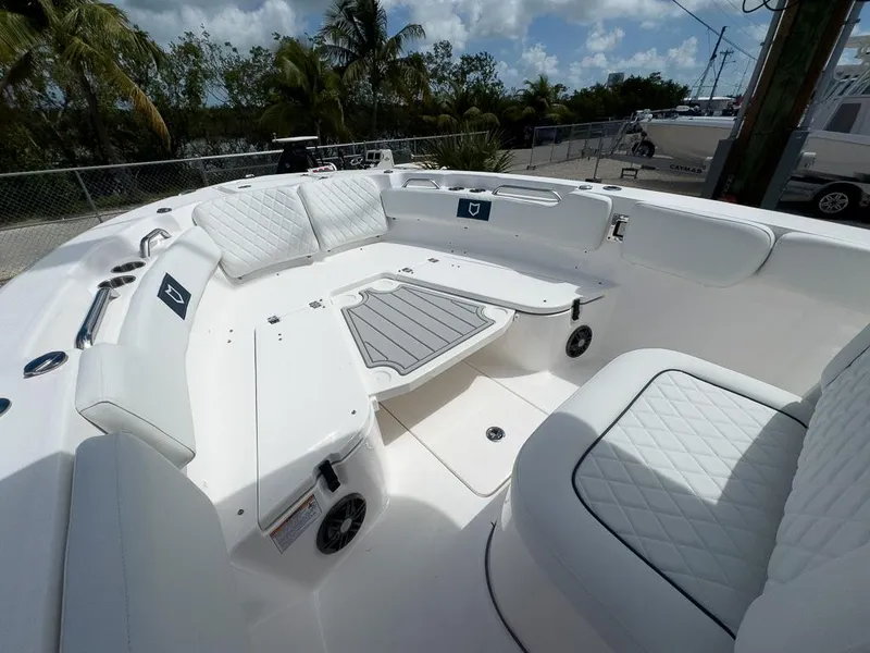 Slide: The Image of 2025 Sea Fox 248 Commander boat interior with white cushioned seating. - 17