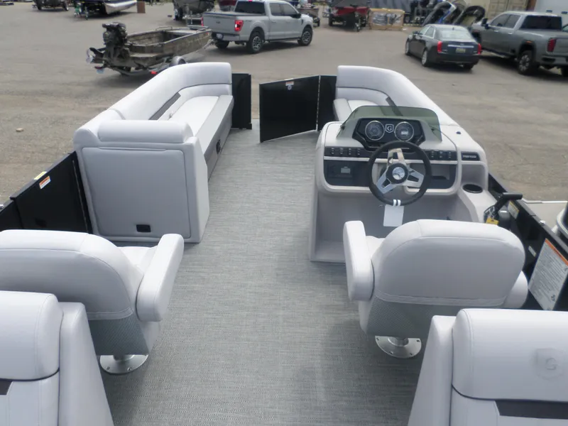 Slide: The Image of 2025 Godfrey Sweetwater 2286 SB Tri pontoon boat interior with modern seating and steering console. - 4