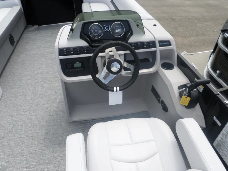 Slide: The Image of 2025 Godfrey Sweetwater 2286 SB Tri pontoon boat helm with modern controls and steering wheel. - 5