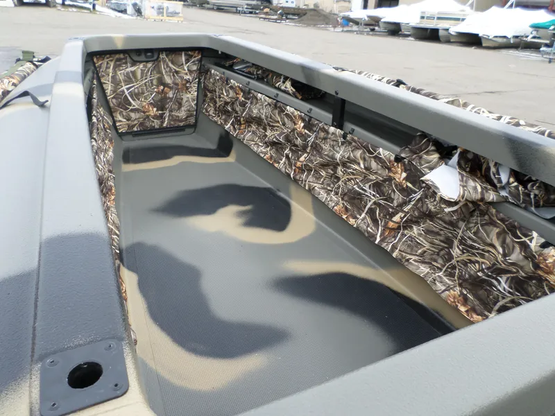 Slide: The Image of 2024 Bankes 14' Dominator boat interior with camouflage design. - 4