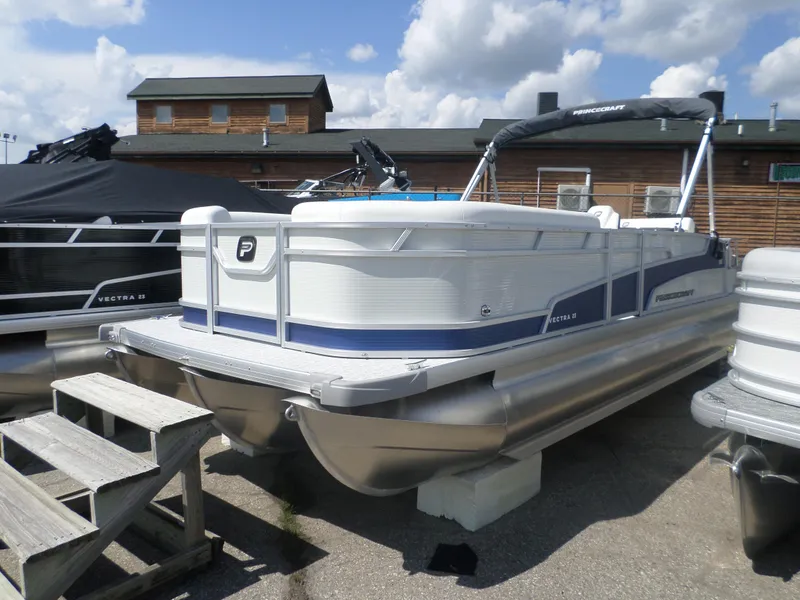 Slide: The Image of 2024 Princecraft VECTRA 23 RL III pontoon boat on display. - 1