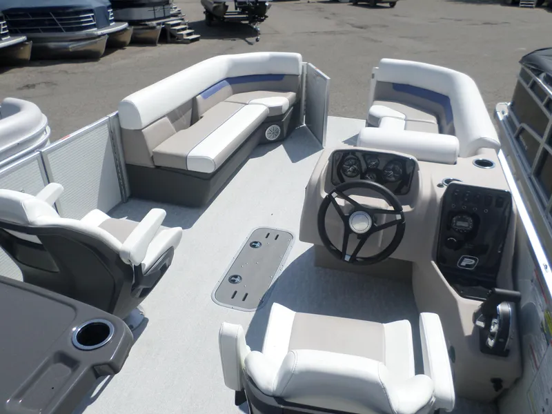 Slide: The Image of 2024 Princecraft VECTRA 23 RL III pontoon boat interior with seating and steering console. - 3
