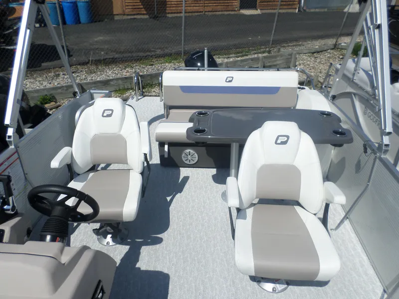 Slide: The Image of 2024 Princecraft VECTRA 23 RL III pontoon boat interior with seating and table. - 4