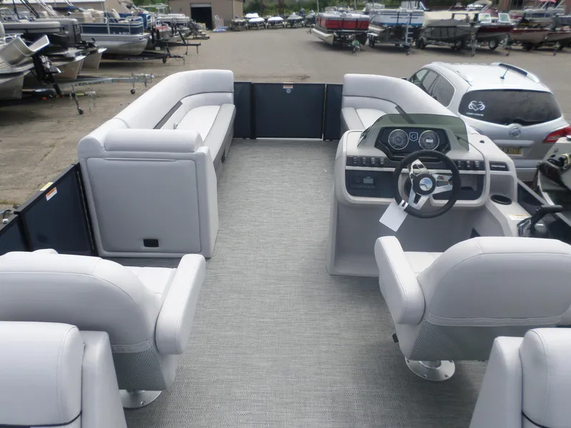 Slide: The Image of 2025 Godfrey Sweetwater 2286 SB Tri pontoon boat interior with helm and seating. - 4
