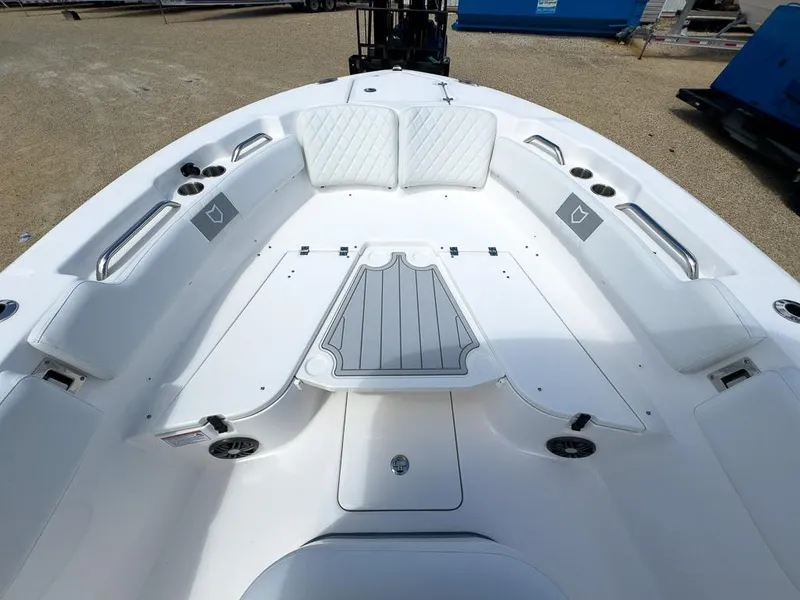 Slide: The Image of 2025 Sea Fox 248 Commander boat interior with white seating and storage compartments. - 18