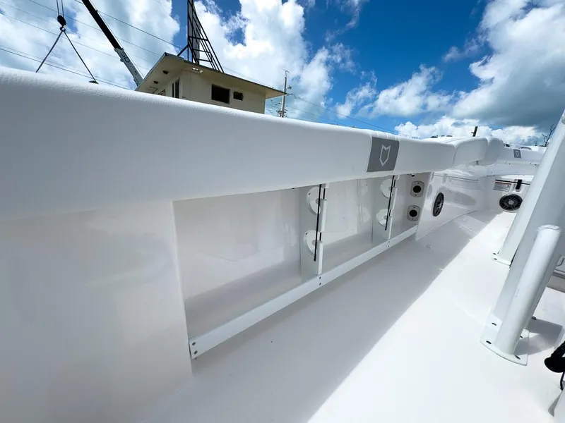 Slide: The Image of 2025 Sea Fox 248 Commander boat deck under a bright blue sky. - 21