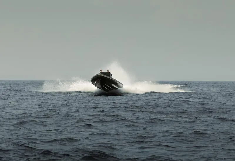 Slide: The Image of Roughneck 1010 boat speeding on open sea, 2022 model. - 14