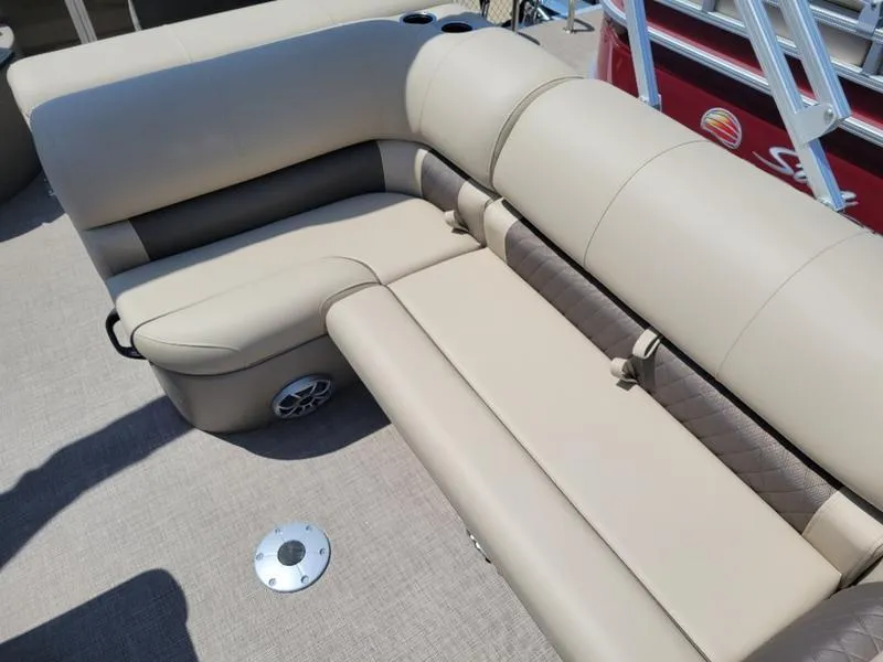 Slide: The Image of 2025 Sun Tracker SF 20 DLX boat interior with beige seating and cup holders. - 13