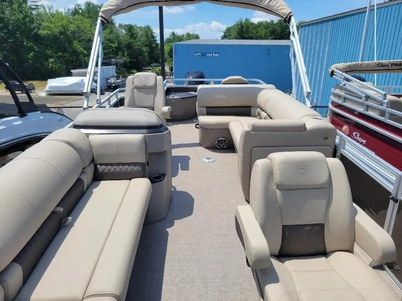 Slide: The Image of 2025 Sun Tracker SF 20 DLX pontoon boat with beige seating and canopy. - 6