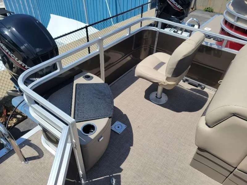 Slide: The Image of 2025 Sun Tracker SF 20 DLX pontoon boat interior with seating and storage. - 9