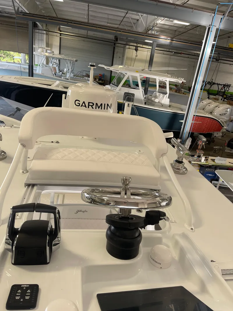 Slide: The Image of 2025 Yellowfin 26 Hybrid boat interior with Garmin navigation system. - 8