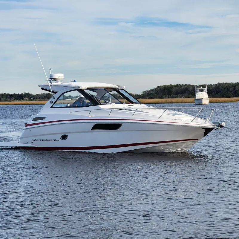 The Image of 2018 Regal 35 Sport Coupe cruising on a calm lake. - 0