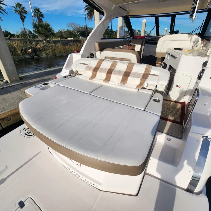 Slide: The Image of 2018 Regal 35 Sport Coupe boat with spacious seating and modern interior. - 13