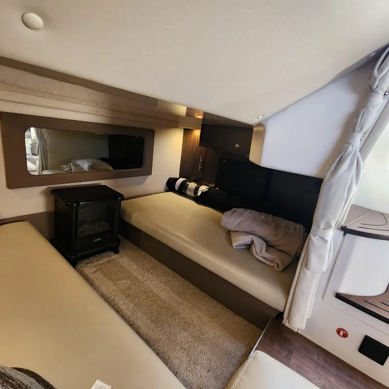 Slide: The Image of Interior cabin of a 2018 Regal 35 Sport Coupe with cozy seating and modern decor. - 33