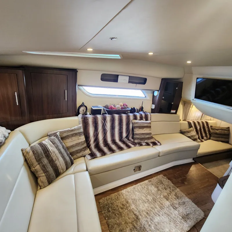Slide: The Image of Luxurious interior of a 2018 Regal 35 Sport Coupe yacht with plush seating and modern decor. - 35