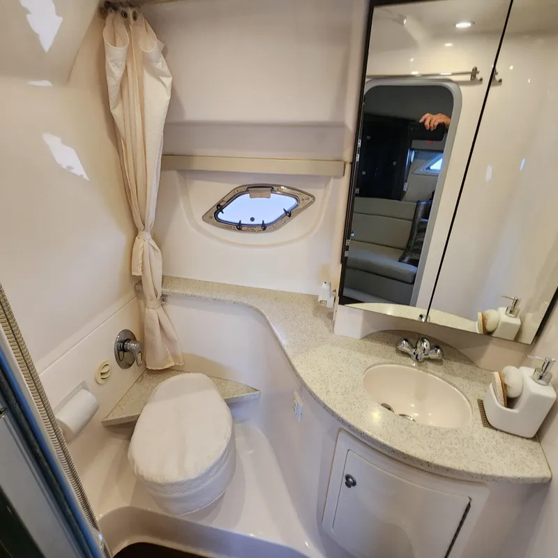 Slide: The Image of 2018 Regal 35 Sport Coupe bathroom with sink, toilet, and mirror cabinet. - 37