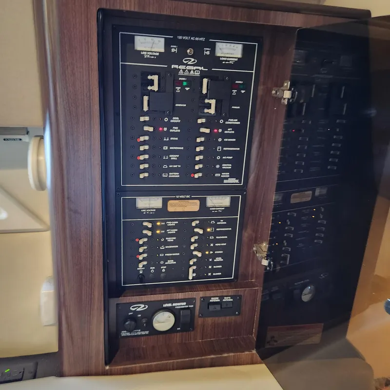 Slide: The Image of Electrical control panel of a 2018 Regal 35 Sport Coupe boat. - 38