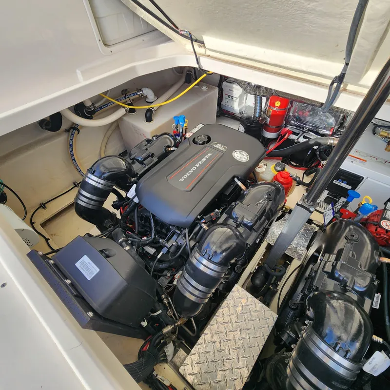 Slide: The Image of Engine compartment of a 2018 Regal 35 Sport Coupe boat with Volvo Penta engines. - 44
