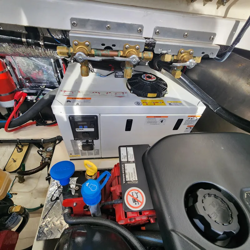 Slide: The Image of Engine compartment of a 2018 Regal 35 Sport Coupe with generator and components. - 45