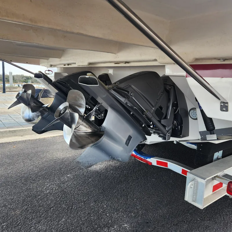Slide: The Image of 2018 Regal 35 Sport Coupe boat propellers and outboard motors on trailer. - 9