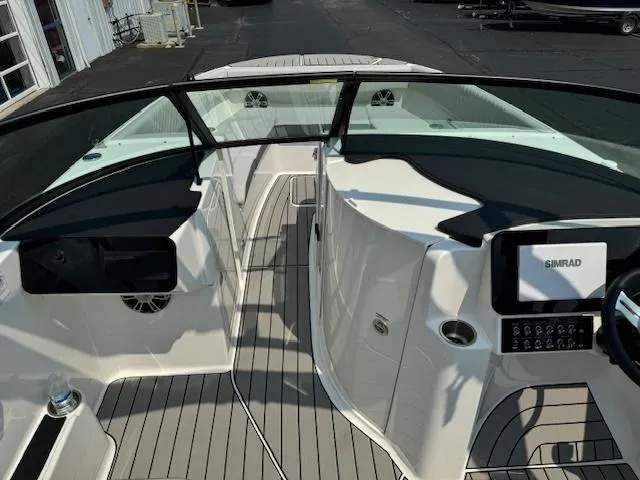 Slide: The Image of 2025 Sea Ray SDX 270 boat interior with modern dashboard and seating. - 6