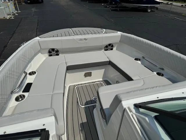 Slide: The Image of 2025 Sea Ray SDX 270 boat interior with spacious seating and modern design. - 7