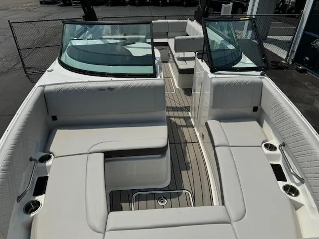 Slide: The Image of 2025 Sea Ray SDX 270 boat interior with white seating and open deck layout. - 8