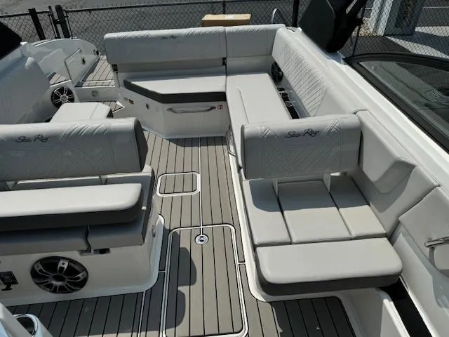 Slide: The Image of 2025 Sea Ray SDX 270 boat interior with spacious seating and modern design. - 9