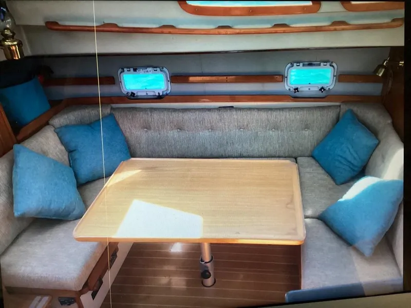 Slide: The Image of Interior of 1986 Nautilus Pilothouse 36 with cozy seating and wooden table. - 12