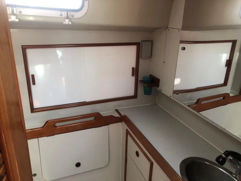 Slide: The Image of 1986 Nautilus Pilothouse 36 interior with cabinets and sink. - 30