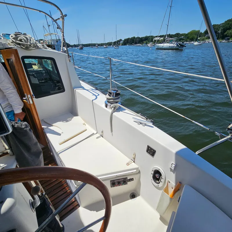 Slide: The Image of 1986 Nautilus Pilothouse 36 sailboat on calm water, sunny day, scenic view. - 38