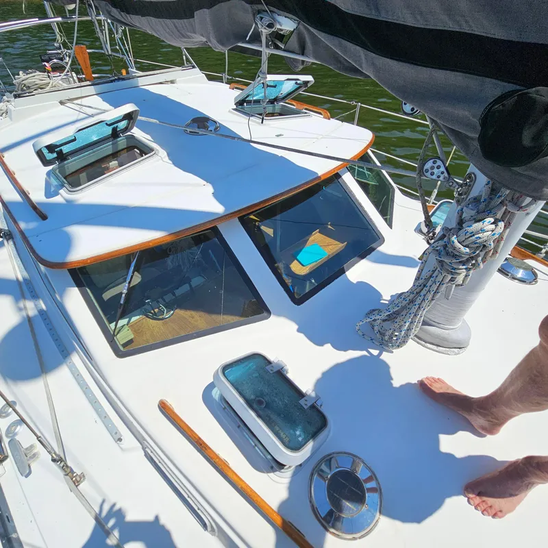 Slide: The Image of 1986 Nautilus Pilothouse 36 sailboat deck with hatches and rigging. - 42