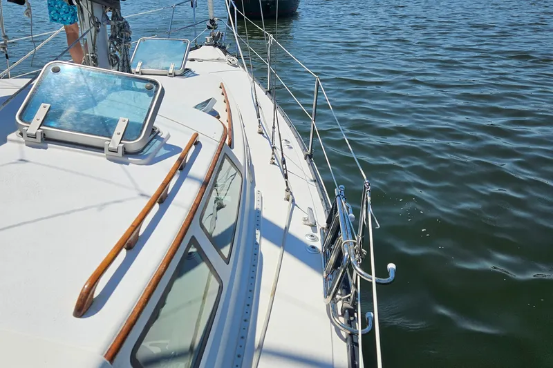 Slide: The Image of 1986 Nautilus Pilothouse 36 sailboat deck on calm water. - 47