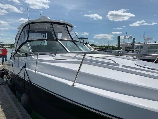 Slide: The Image of 2020 Monterey 345 Sport Yacht docked under a clear blue sky. - 10