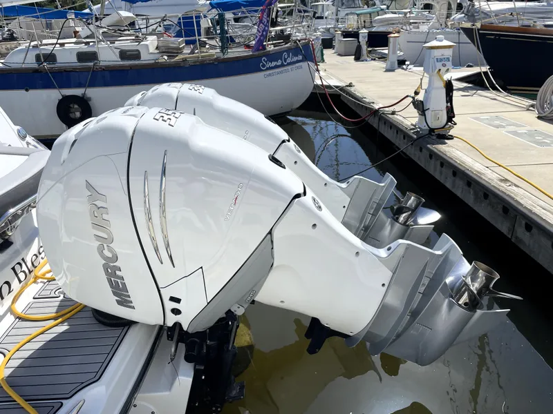 Slide: The Image of 2020 Monterey 345 Sport Yacht with Mercury outboard engines docked at marina. - 11