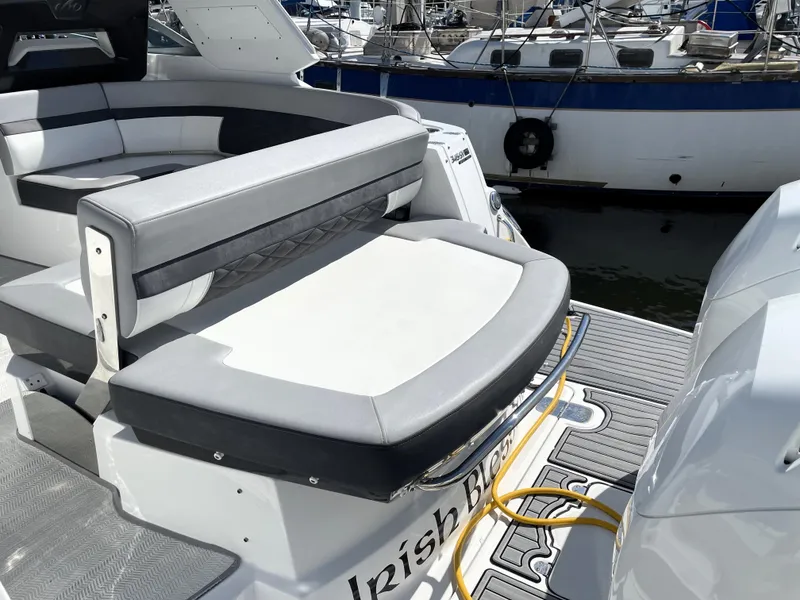 Slide: The Image of Monterey 345 Sport Yacht 2020, sleek seating area, docked at marina. - 21