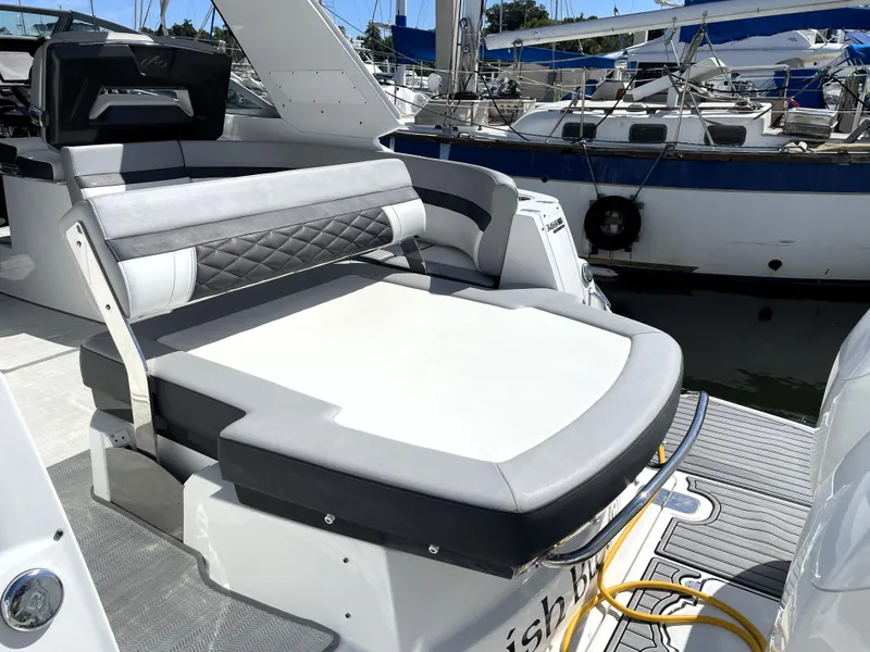 Slide: The Image of 2020 Monterey 345 Sport Yacht with sleek seating at marina. - 22