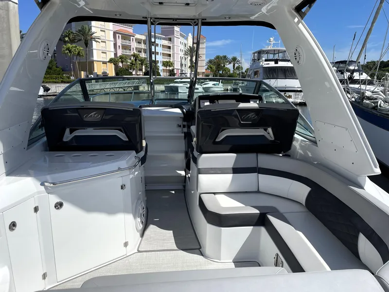 Slide: The Image of 2020 Monterey 345 Sport Yacht interior with sleek seating and modern design. - 23