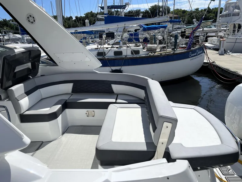 Slide: The Image of 2020 Monterey 345 Sport Yacht with sleek seating at marina. - 25