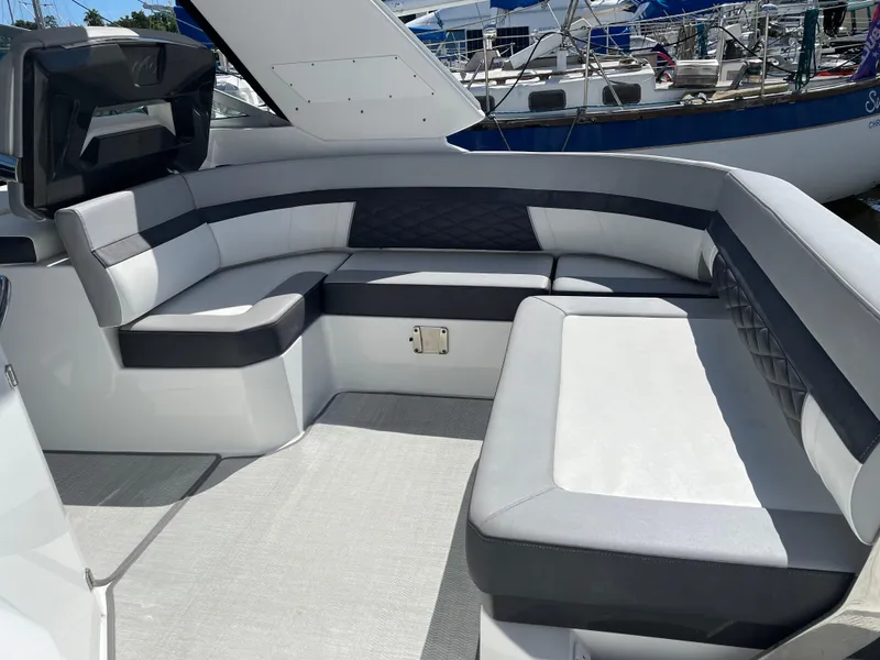 Slide: The Image of 2020 Monterey 345 Sport Yacht interior with sleek seating and modern design. - 26