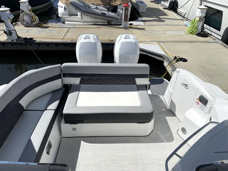 Slide: The Image of 2020 Monterey 345 Sport Yacht at dock, featuring spacious seating and dual engines. - 27