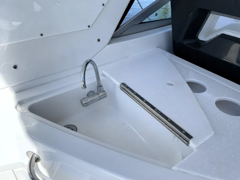 Slide: The Image of Monterey 345 Sport Yacht 2020 sink and faucet detail on deck. - 29