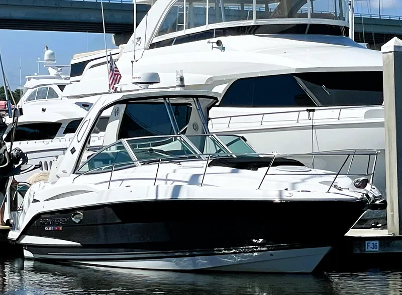 Slide: The Image of 2020 Monterey 345 Sport Yacht docked at marina, sleek design, luxury vessel. - 3
