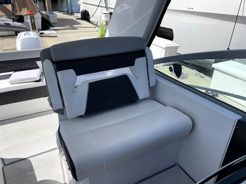 Slide: The Image of Luxury seating on 2020 Monterey 345 Sport Yacht, docked at marina. - 33