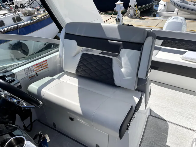 Slide: The Image of 2020 Monterey 345 Sport Yacht interior seating with modern design and quilted upholstery. - 34