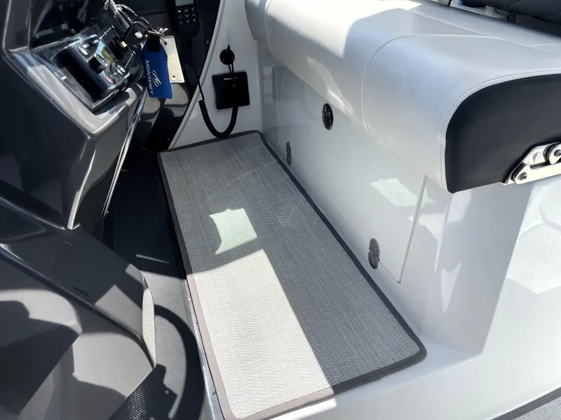Slide: The Image of Interior of 2020 Monterey 345 Sport Yacht with sleek seating and modern controls. - 35